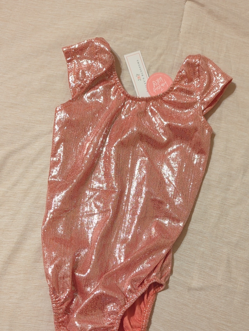 Shimmery Pink Girls' One-Piece Bodysuit by (no brand visible)
